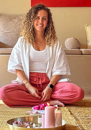 afifa looking at the camera sitting on the floor